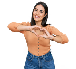 Young hispanic woman wearing casual clothes smiling in love doing heart symbol shape with hands. romantic concept.