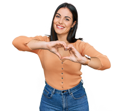 Young hispanic woman wearing casual clothes smiling in love doing heart symbol shape with hands. romantic concept.