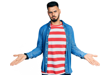 Young hispanic man with beard wearing casual denim jacket clueless and confused with open arms, no idea concept.