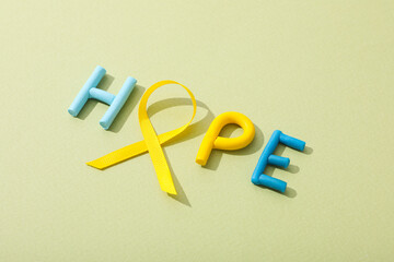 The inscription hope with a yellow ribbon