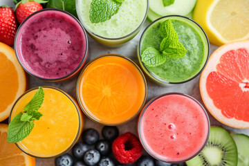 Vegetable and fruit smoothies in glasses, top view