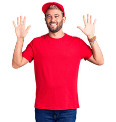 Young handsome blond man wearing t-shirt and cap showing and pointing up with fingers number ten while smiling confident and happy.