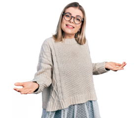 Young blonde woman wearing glasses smiling cheerful with open arms as friendly welcome, positive and confident greetings