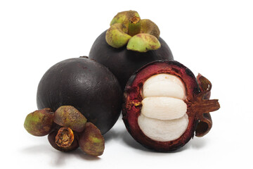 Fototapeta premium Half cut sliced and two whole fresh organic mangosteen delicious fruit isolated on white background clipping path