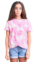 Obraz premium Cute hispanic child girl wearing casual clothes depressed and worry for distress, crying angry and afraid. sad expression.