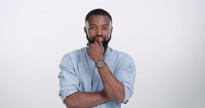 Thinking, face and black man in studio listening to interesting drama, story or gossip on white background. Attention, portrait and African male model with emoji gesture, expression or body language
