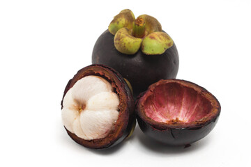 Half cut sliced and whole fresh organic mangosteen delicious fruit with peel isolated on white background clipping path