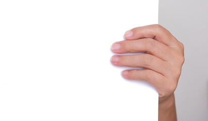 close up shot of hand holding white blank paper