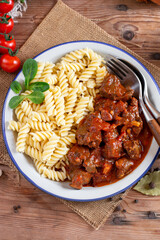 Goulash with noodles and vegetables seasoned with paprika and spices. Perfect for recipe, article, menu book, or any cooking contents. typical Czech food. Hungarian cuisine.