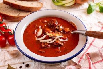 Goulash soup with beef and sweet pepper. Stew of meat and vegetables, flavored with paprika. Hungarian cuisine.