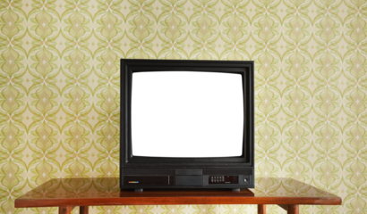 Antique TV with white screen on antique wooden cabinet, vintage design in 80s and 90s style house.