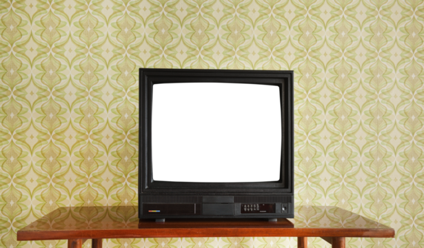 Antique TV with white screen on antique wooden cabinet, vintage design in 80s and 90s style house.