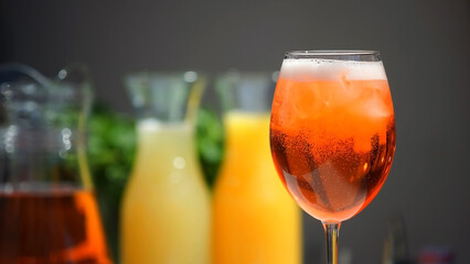 Champagne in an aperol spritz cocktail glass with orange slices. Vacation, summer, vacation, concept of luxury resort and delicious drinks