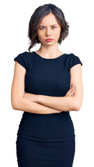 Fototapeta premium Young beautiful girl wearing casual clothes skeptic and nervous, disapproving expression on face with crossed arms. negative person.