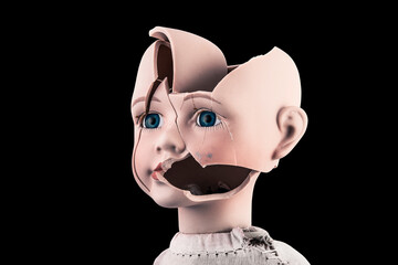 Broken vintage doll head isolated on black background with clipping path