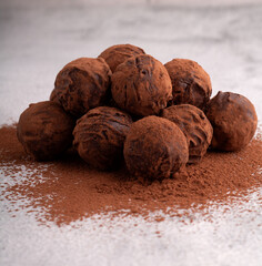 photo homemade dark chocolate truffles, a sweet and energy-packed dessert. of cocoa-coated treats, promising a rich and satisfying flavor experience. 