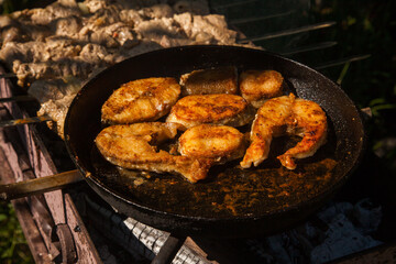 Fototapeta premium Pan frying or home cooking fish on the fire.