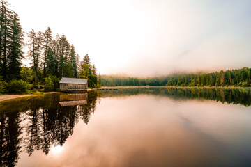View of the surrounding landscape at Ödensee in Bad Mitterndorf in Styria. Nature at the clear swimming lake in the Salzkammergut in Austria.
