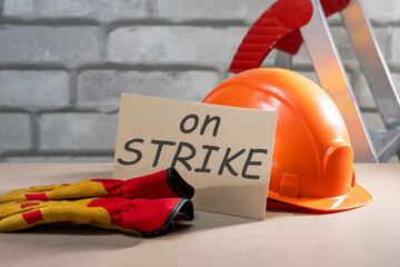 poster with text ON STRIKE on desktop. on strike concept.