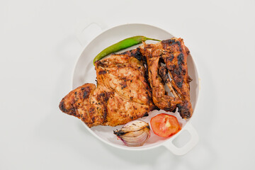 Grilled Charcoal Chicken with Pickles - A Flavorful Culinary Feast. Special Arabic Style Charcoal Chicken with grilled Onion, Tomato and chilli with vegetable pickles ..