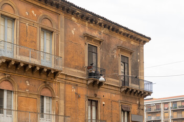 Facade of the old house with balcony in Catania Sicily Italy.