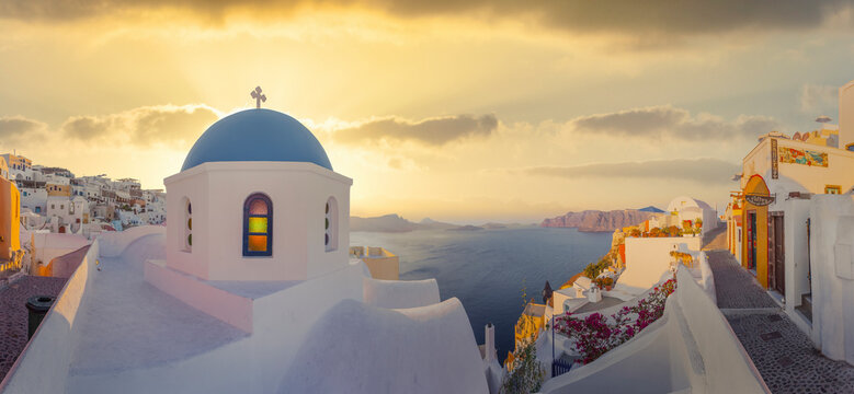View of Oia at sunset, a small town with whitewashed houses on Santorini Island, Cyclades islands archipelagos, Aegean Sea, Greece.