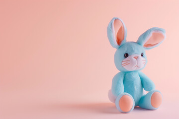 Cute Easter bunny rabbit soft kids toy with blank empty space for baby product or text mockup, plain backdrop background  