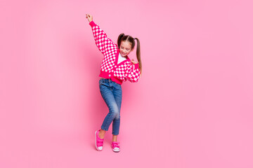 Full size photo of good mood schoolgirl with tails dressed knit cardigan hand up dancing having fun...