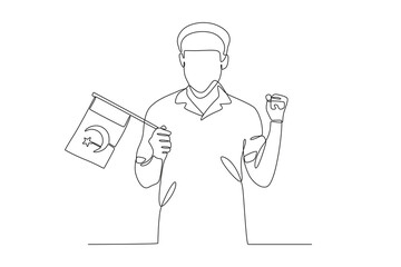 A man holding a Pakistani flag with enthusiasm