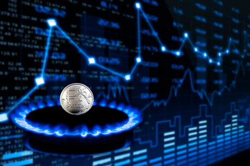 Graph of rise, fall, natural gas prices. Coin Russian ruble on a gas burner. The concept of paying...