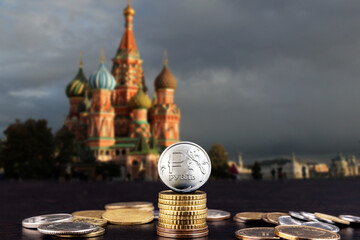 New coin of the Russian ruble on the background of Moscow, soft blurred background.