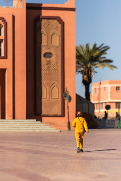 View of a person walking in the medina of Ouarzazate, Morocco.