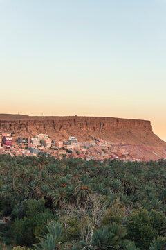 View of the Palmeraie de Tinghir, a valley with palm trees near Ait Ismene village at sunset, Tinghir, Morocco.