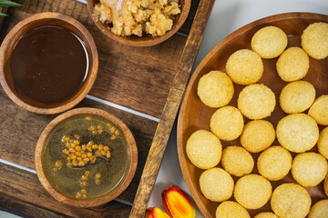 Gourmet Delight: Vibrant Pani Puri, India's Irresistible Street Food Sensation. The golden, crispy puris filled with a delightful spiced potatoes, chickpeas, and tamarind chutney with spiced water