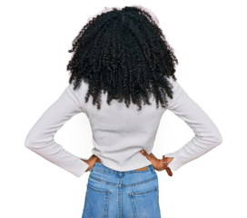 Young african american girl wearing casual clothes standing backwards looking away with arms on body