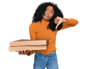 Young african american girl holding delivery pizza box with angry face, negative sign showing dislike with thumbs down, rejection concept