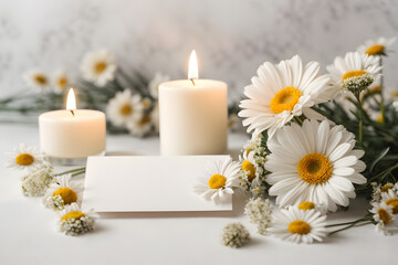 A romantic, minimal and floral concept photo with white daisies, candles and note paper