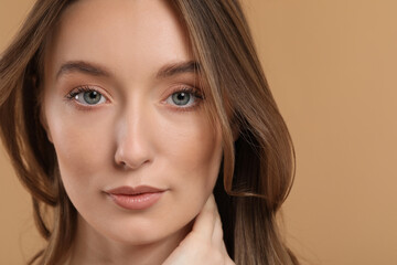 Fototapeta premium Beautiful woman with healthy skin on beige background, closeup