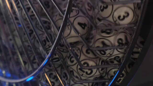 Balls with numbers rotate in a lottery machine