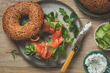 delicious curred salmon, cream cheese and cucumber bagel sandwich