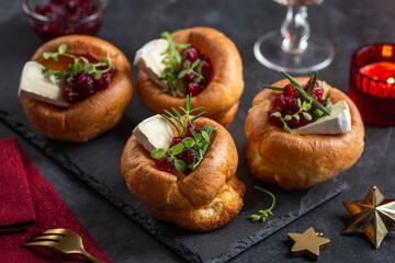 Traditional Yorkshire puddings with brie cheese and cranberry jam
