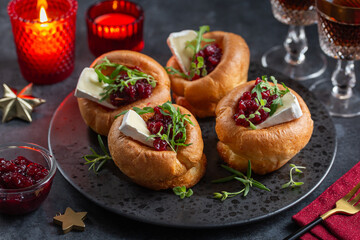 Naklejka na ściany i meble Yorkshire puddings with brie cheese and cranberry jam