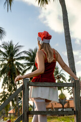 Girl in Santa hat at the beach Travel Asia