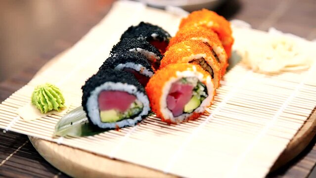 Sushi maki rolls with salmon, Philadelphia cheese, and avocado	