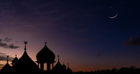 Silhouette dome mosques on twilight sky and crescent moon, Religious of Islamic well space for text...