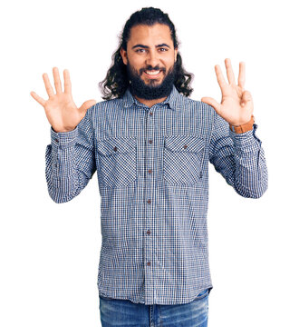Young arab man wearing casual clothes showing and pointing up with fingers number nine while smiling confident and happy.