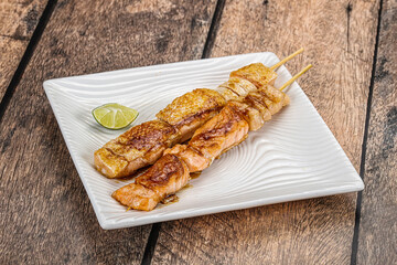 Grilled salmon skewer with sauce