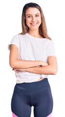 Fototapeta premium Young beautiful girl wearing casual t shirt happy face smiling with crossed arms looking at the camera. positive person.