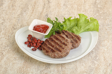 Grilled beef burger cutlet with sauce