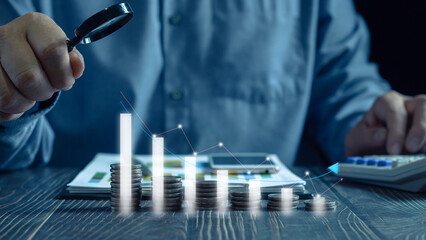 Economic collapse concept. Stack of coins with chart icon with arrow pointing down, financial and banking problems, recession, financial crisis, bad debt, inflation and interest rates. Asset Security
